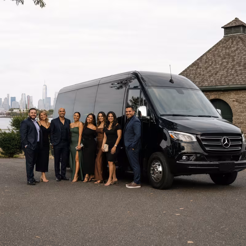 Group beside a Mercedes Sprinter limo from the Newark fleet