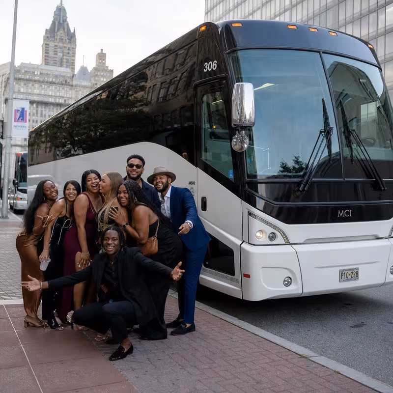 Passengers loading luggage while boarding an Newark group shuttle