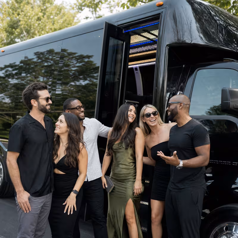 Passengers loading luggage while boarding an Newark group shuttle