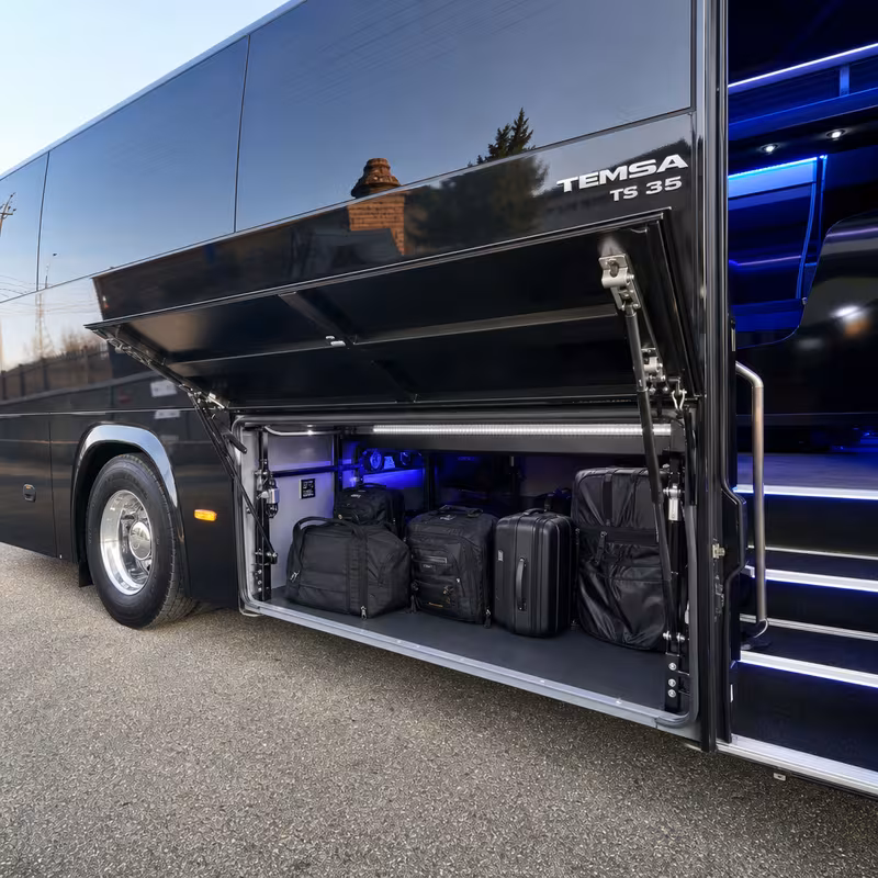 Party bus interior with wraparound leather seating and LED lighting in Newark