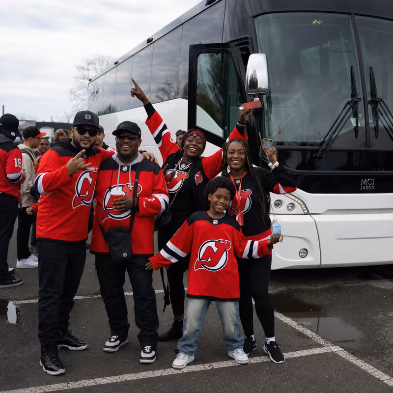 Passengers loading luggage while boarding an Newark group shuttle