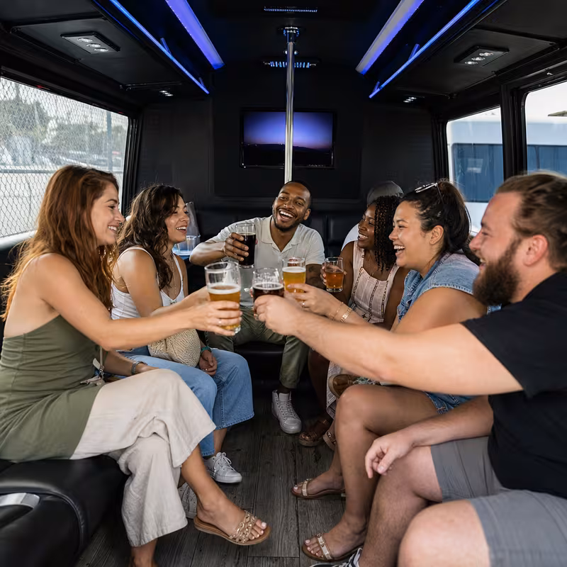 Group boarding a white charter bus for Winery & Brewery Tour Transportation transportation in Newark